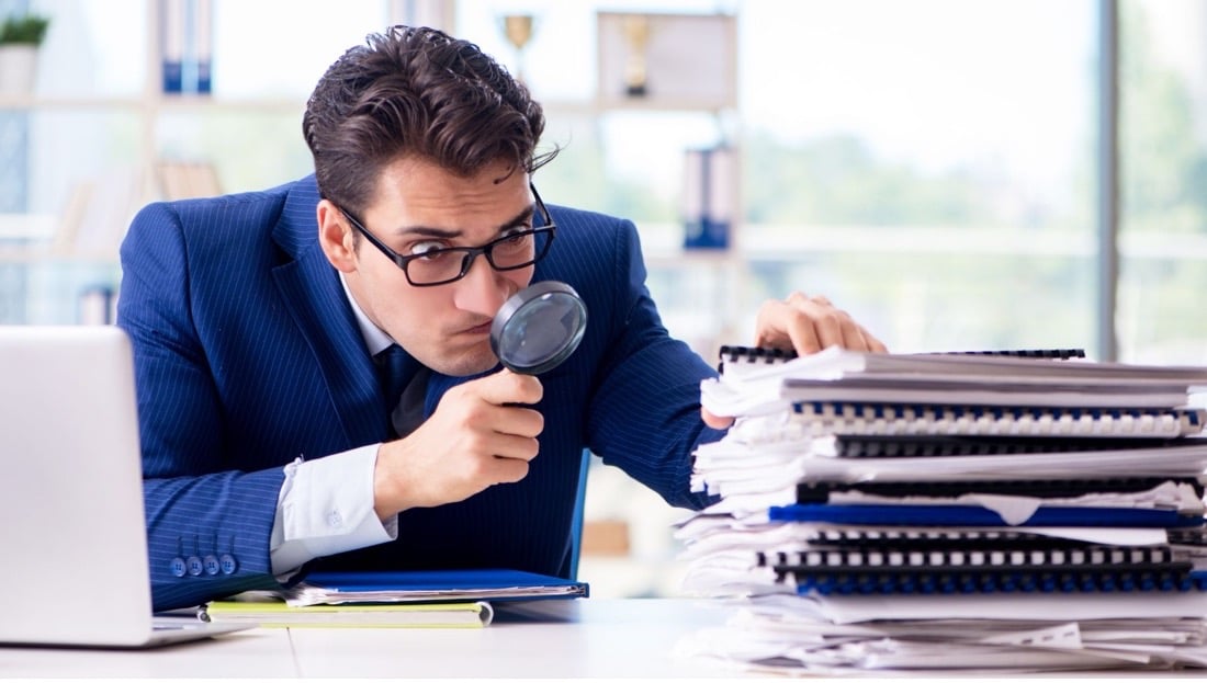 A man is checking documents